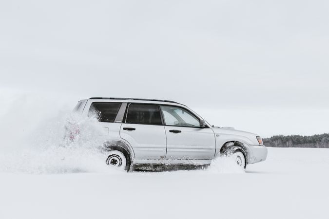 Car driving on snow field