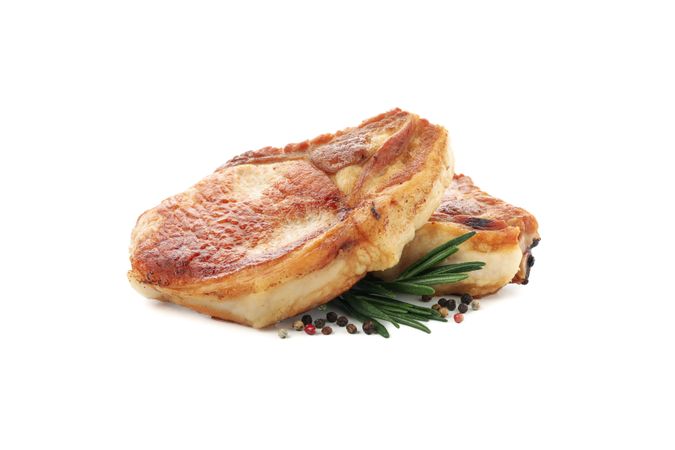 Fried pork steaks isolated on blank background. Grilled food