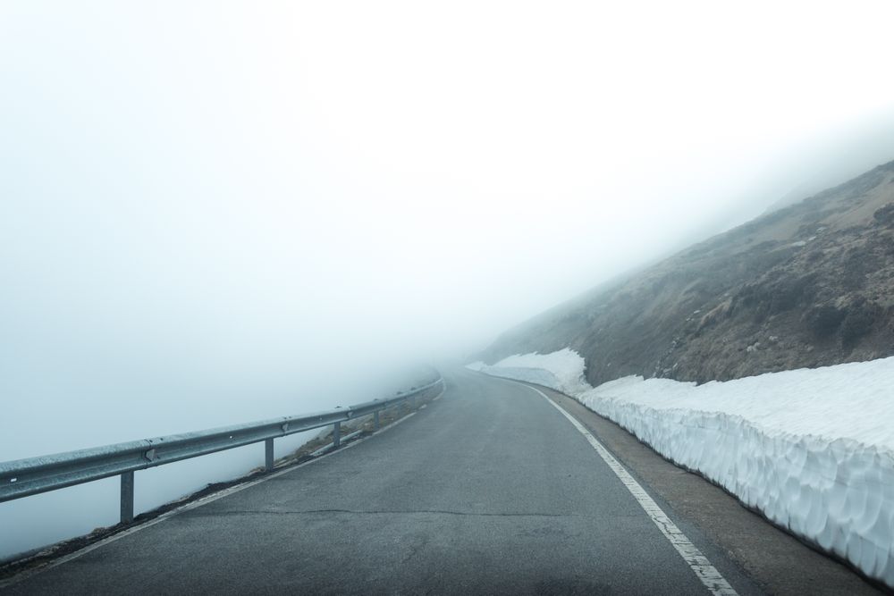 Road in foggy mountains