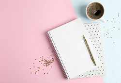 Cup of coffee with copybooks, glitter stars and pen on color background, space for text