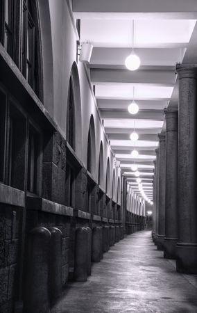 Long passage with elegant columns and lights