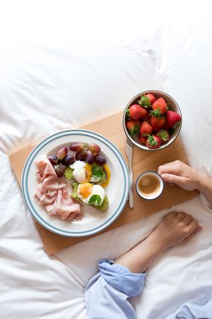 Tasty breakfast served on bed