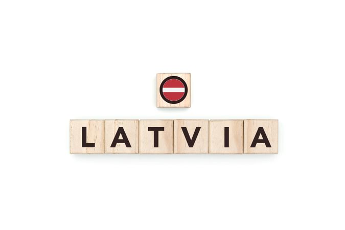 Wooden blocks bearing the name and flag of Latvia.