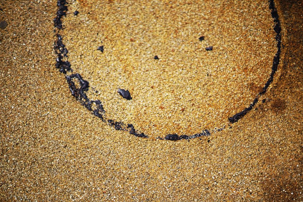 Wet sand texture with circle trace
