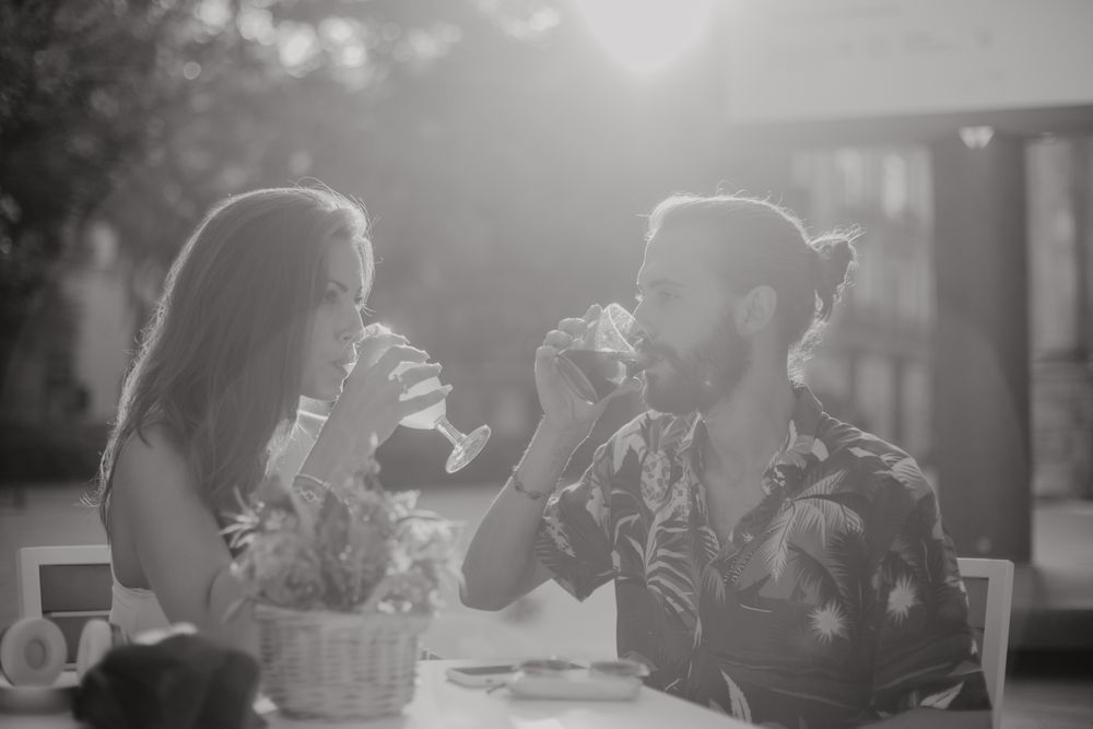 Loving couple clinking glasses on cafe terrace