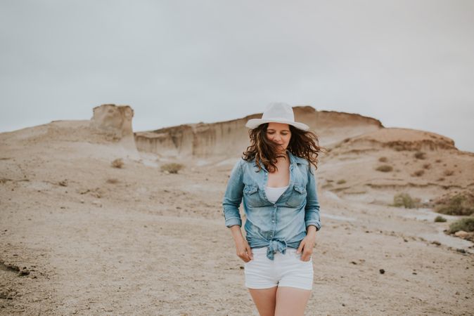 Female tourist walking on sandy quarry