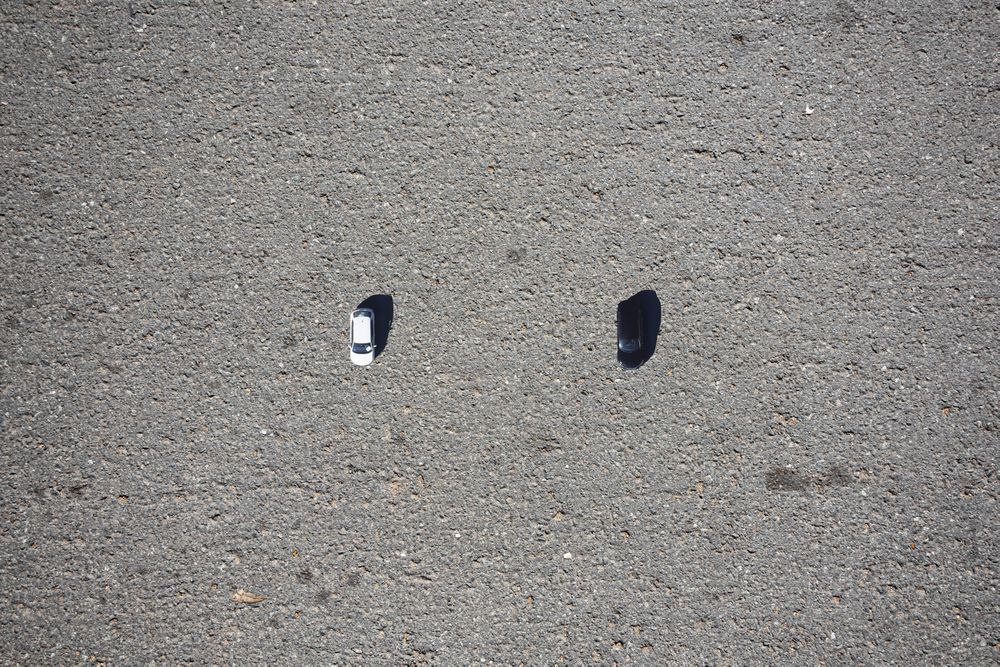 Conceptual image of two cars seen from a drone