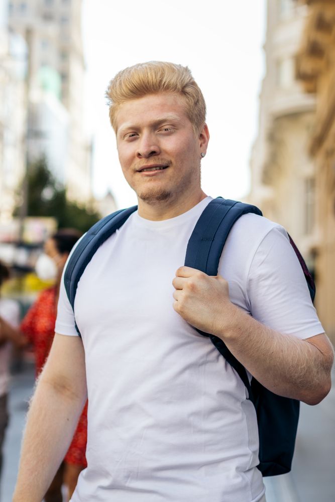 Portrait of a Latino man with albinism in the city