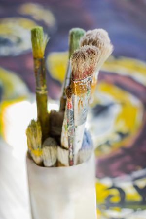 Set of paint brushes on oil painting