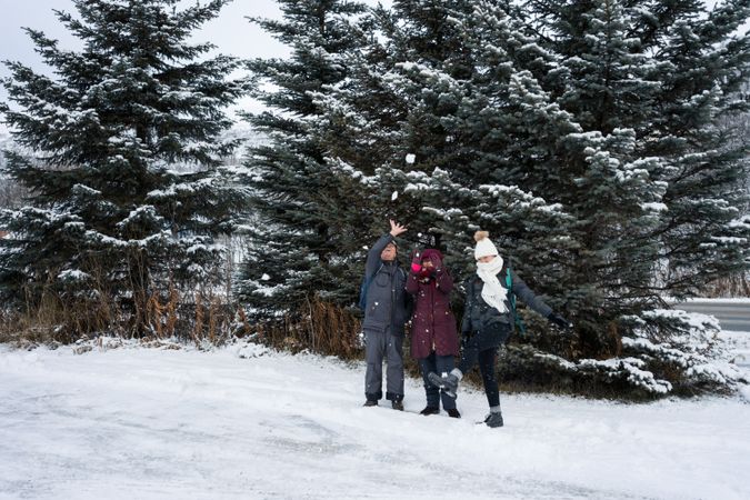Family playing with snowballs