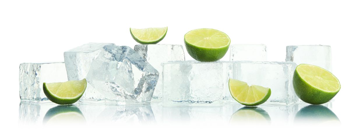 Ice cubes and slices of lime, wide