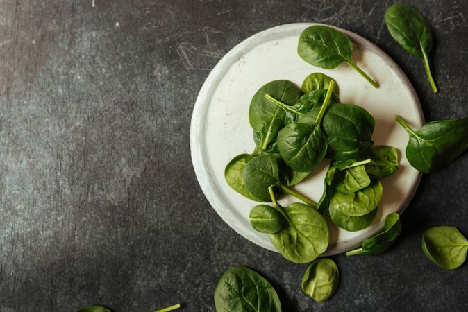 Fresh spinach on a rustic concrete crockery