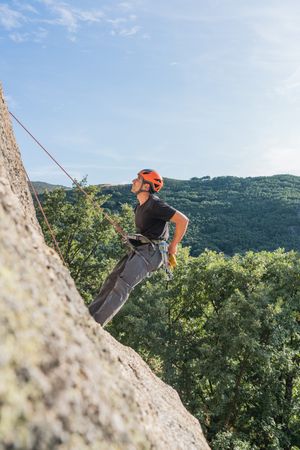 Man climbing a rock