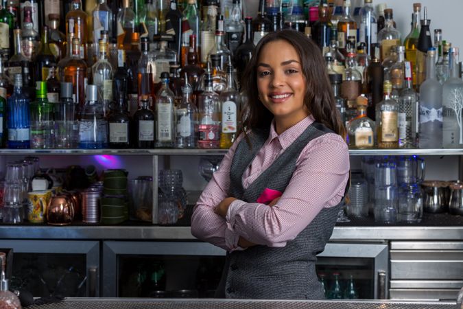 Confident bartender standing at the counter