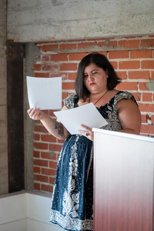 Woman revising her notes before giving a talk