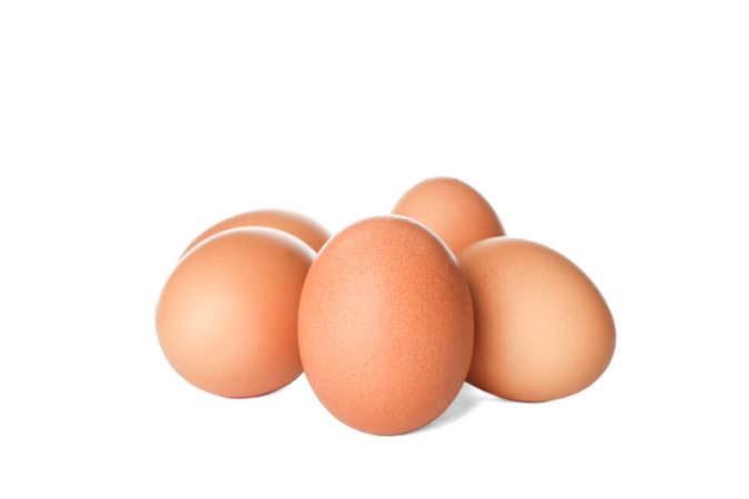 Few raw chicken eggs on plain background