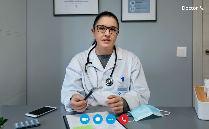Video call screen with female doctor attending a consultation