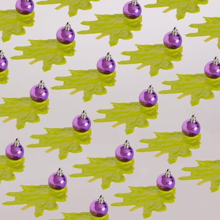 Pattern of purple Christmas decoration with green abstract tree