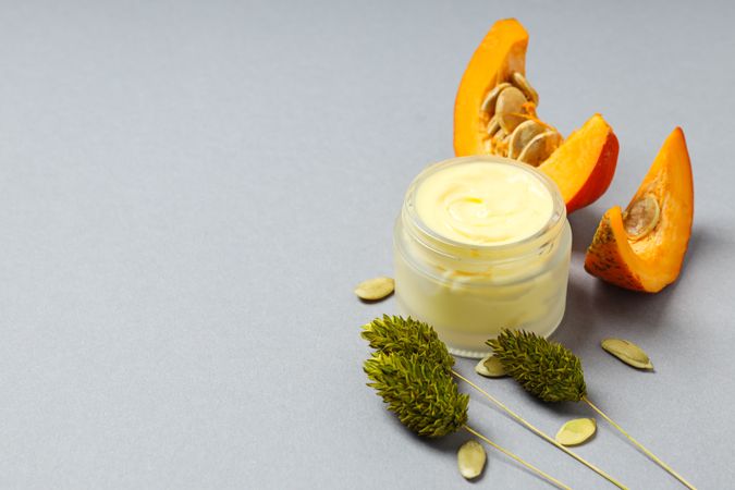 Skin care and face care concept - pumpkin cosmetic