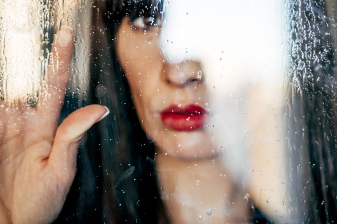 Stylish woman kissing glass