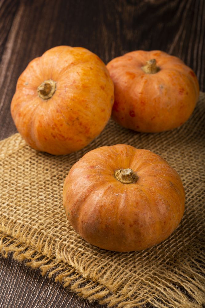 Pumpkins on the wooden table.