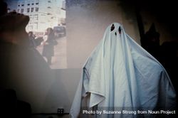 Person in sheet ghost costume 4dLaa4