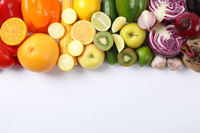 Different vegetables and fruits on plain background, copy space