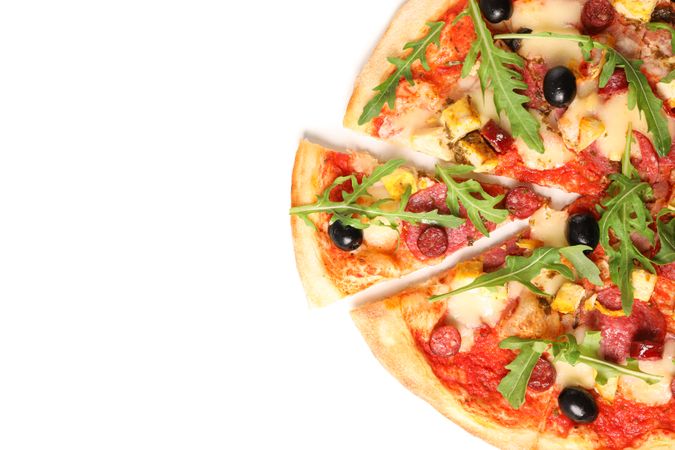 Meat pizza with arugula isolated on blank background, top view