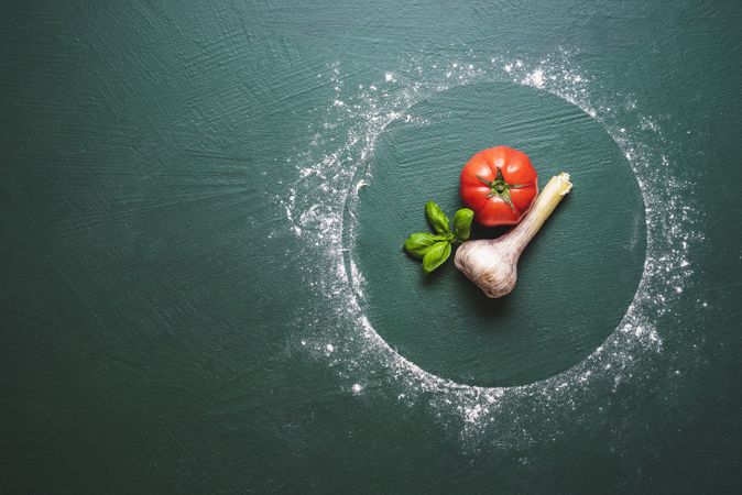 Ingredients for the pizza tomato sauce inside flour ring