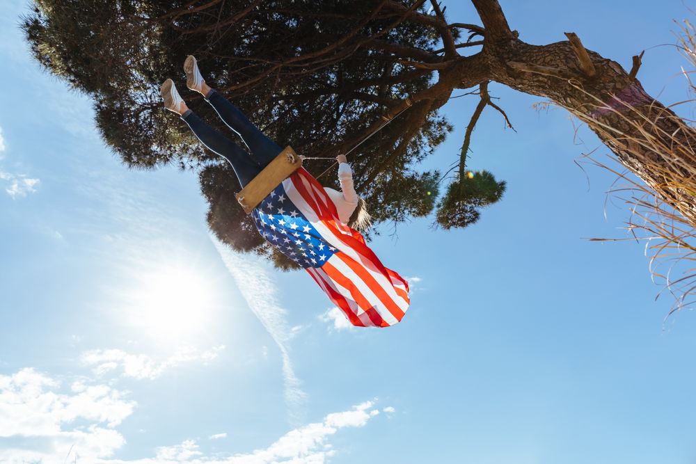 Woman with American flag on swing