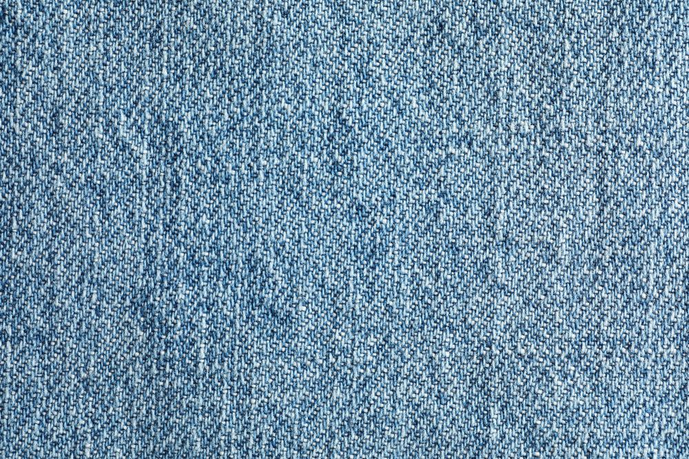 Texture of blue jeans as background, space for text