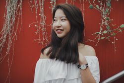 Girl wearing light off-shoulder top
