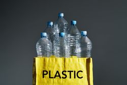 Plastic bottles in yellow bag for recycling