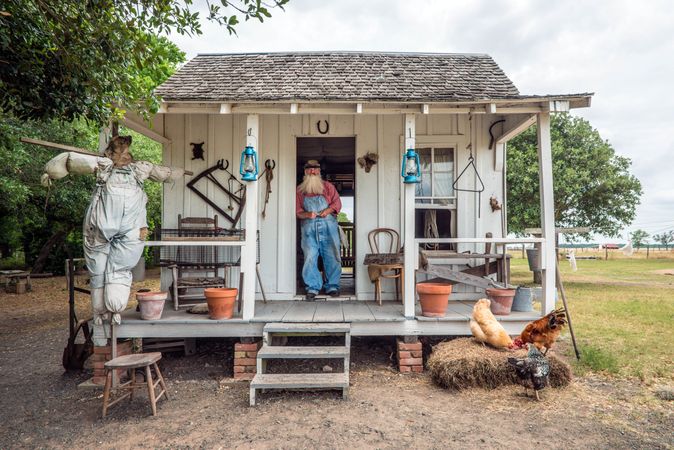 "Uncle Bob" Beringer at a sharecropper's cabin on the George Ranch Historical Park, Texas