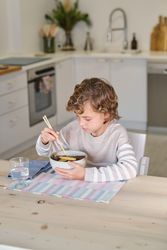 Boy enjoying delicious lunch in kitchen