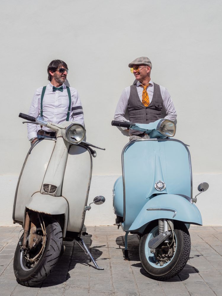 Trendy friends with vintage scooters