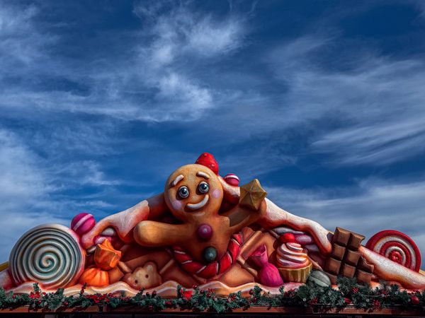 Gingerbread man on candy stall roof in Christmas village
