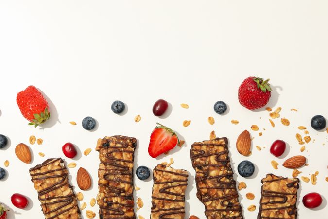 Tasty granola bars on blank background, top view