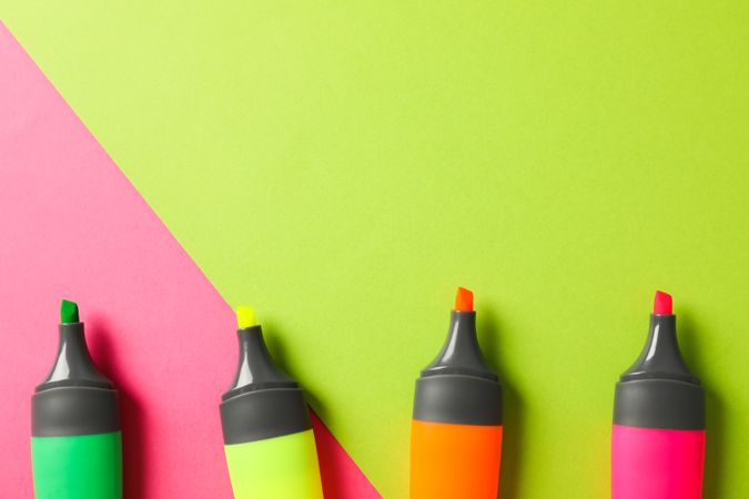 Open highlighters on two tone background, space for text