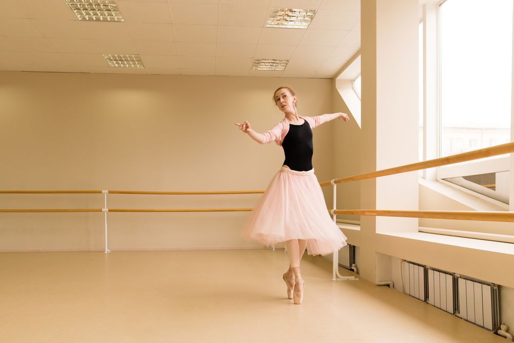 Ballet dancer performing graceful turn en pointe