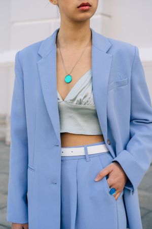 Woman in blue blazer and crop top