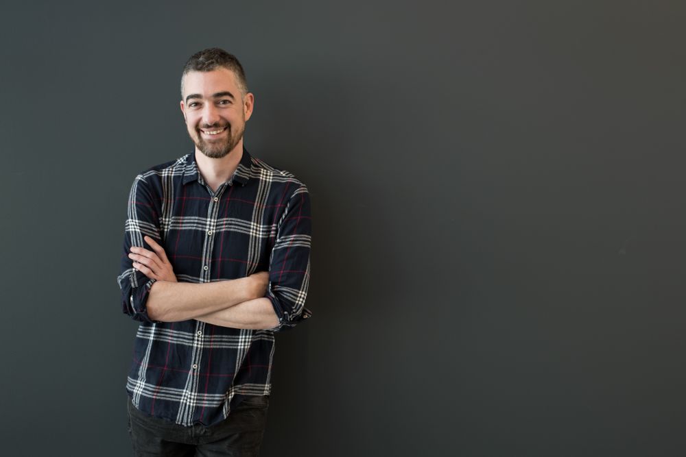 Smiling man posing in casual clothes