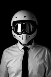 Rider in helmet and glasses at studio
