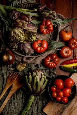 Assorted vegetables and napkins on table
