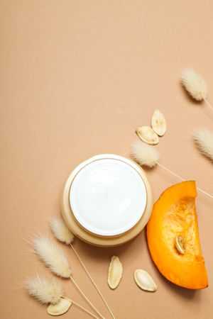 Skin care and face care concept - pumpkin cosmetic