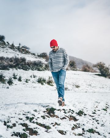 Man walking on winter field