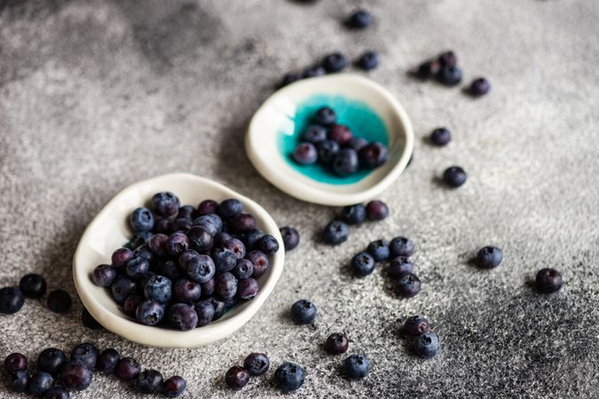Two small dishes with blueberries