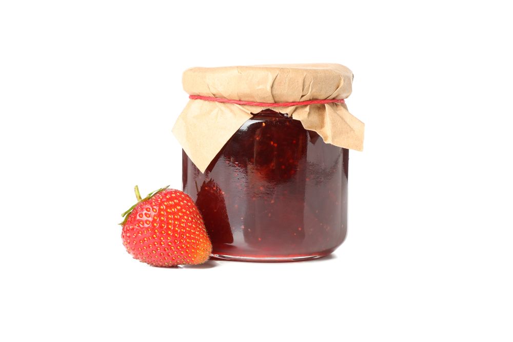 Delicious strawberry jam isolated on plain background