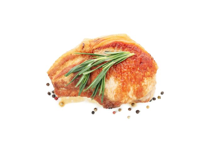 Fried pork steak isolated on light background. Grilled food