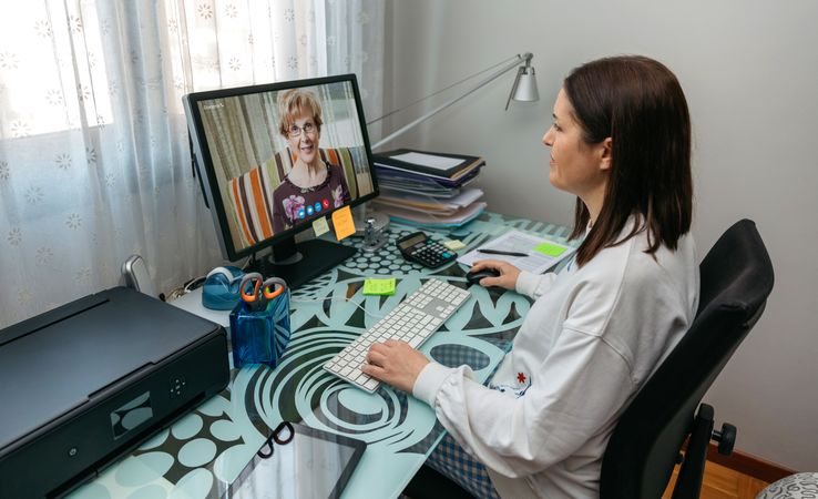 Woman talking on video call with her mother